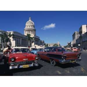 Street Scene of Old American Automobiles Near the Capitolio Building 