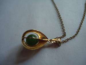   METAL NECKLACE WITH PENDANT GREEN BEAD INSIDE CAGE ? VINTAGE  