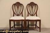 set of 8 shield back chairs are pierced and hand carved with 