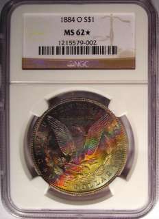 1884 O Morgan Silver Dollar NGC MS62*   Rainbow Toned Star Coin 