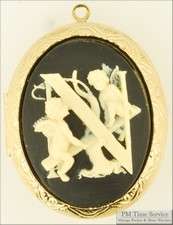 YBM lg. oval engraved locket, black cameo, N & cherub  